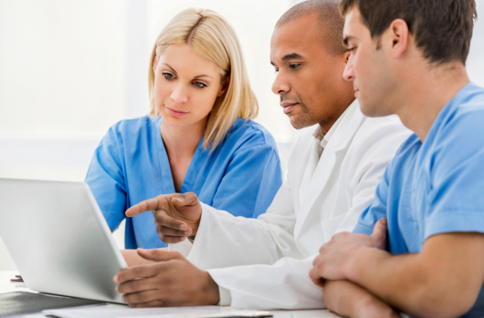 a doctor consulting with his colleagues